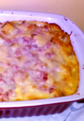 Benedict Casserole: Eggs, English Muffin Pieces, Ham and Cheese Baked in Casserole Pan.